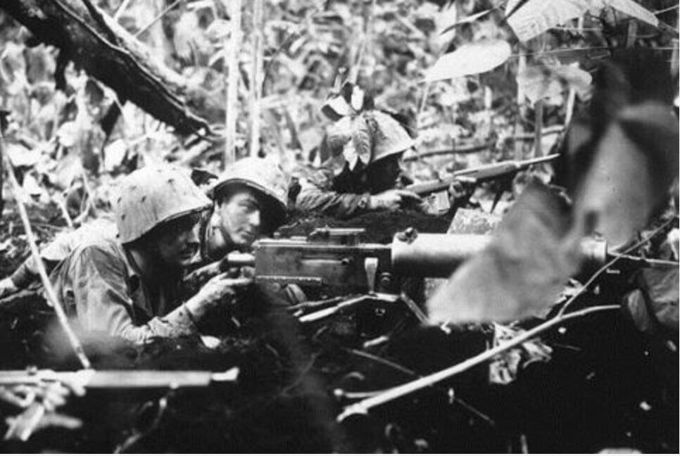 black and white photo of soldiers shooting an M1917 water-cooled machine gun 